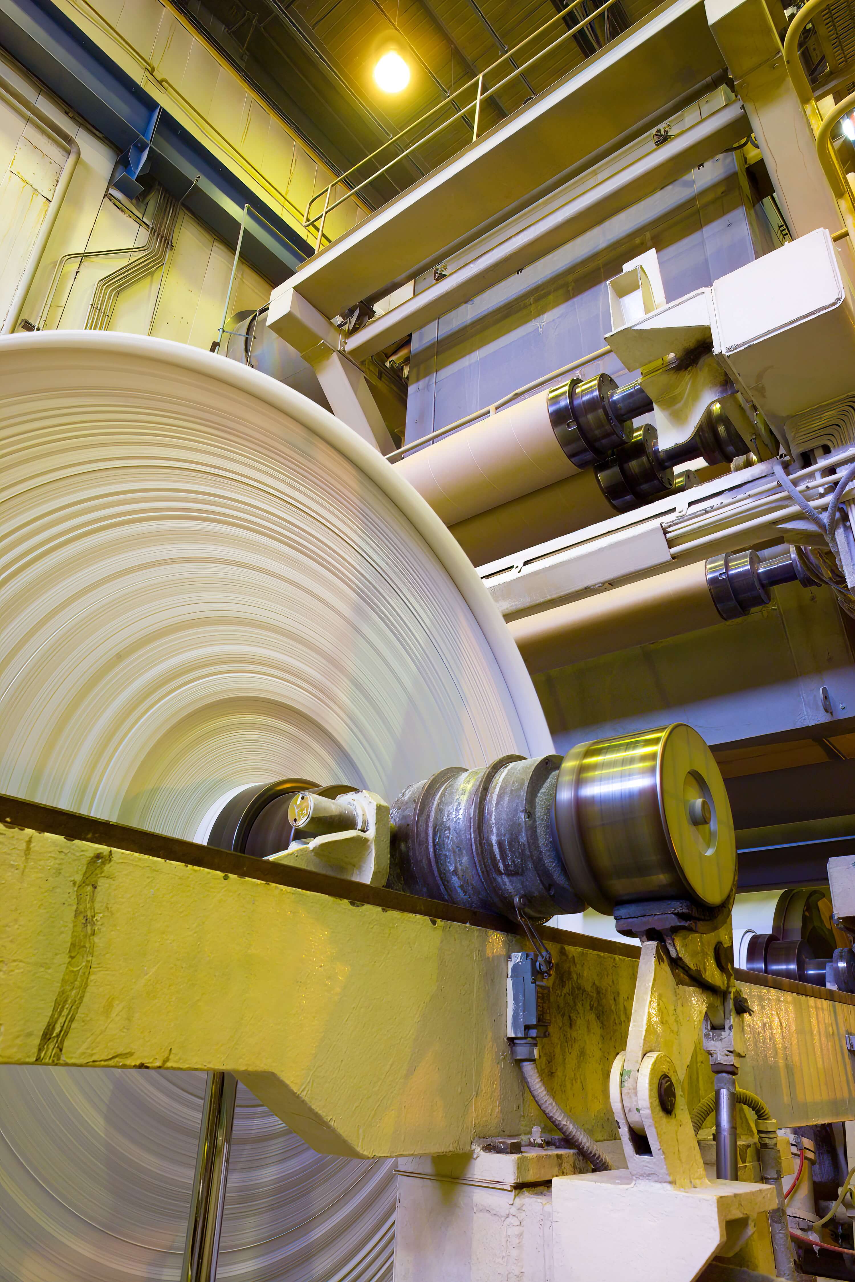 A1_big-rolls-paper-coming-out-machinery-paper-mill-plant