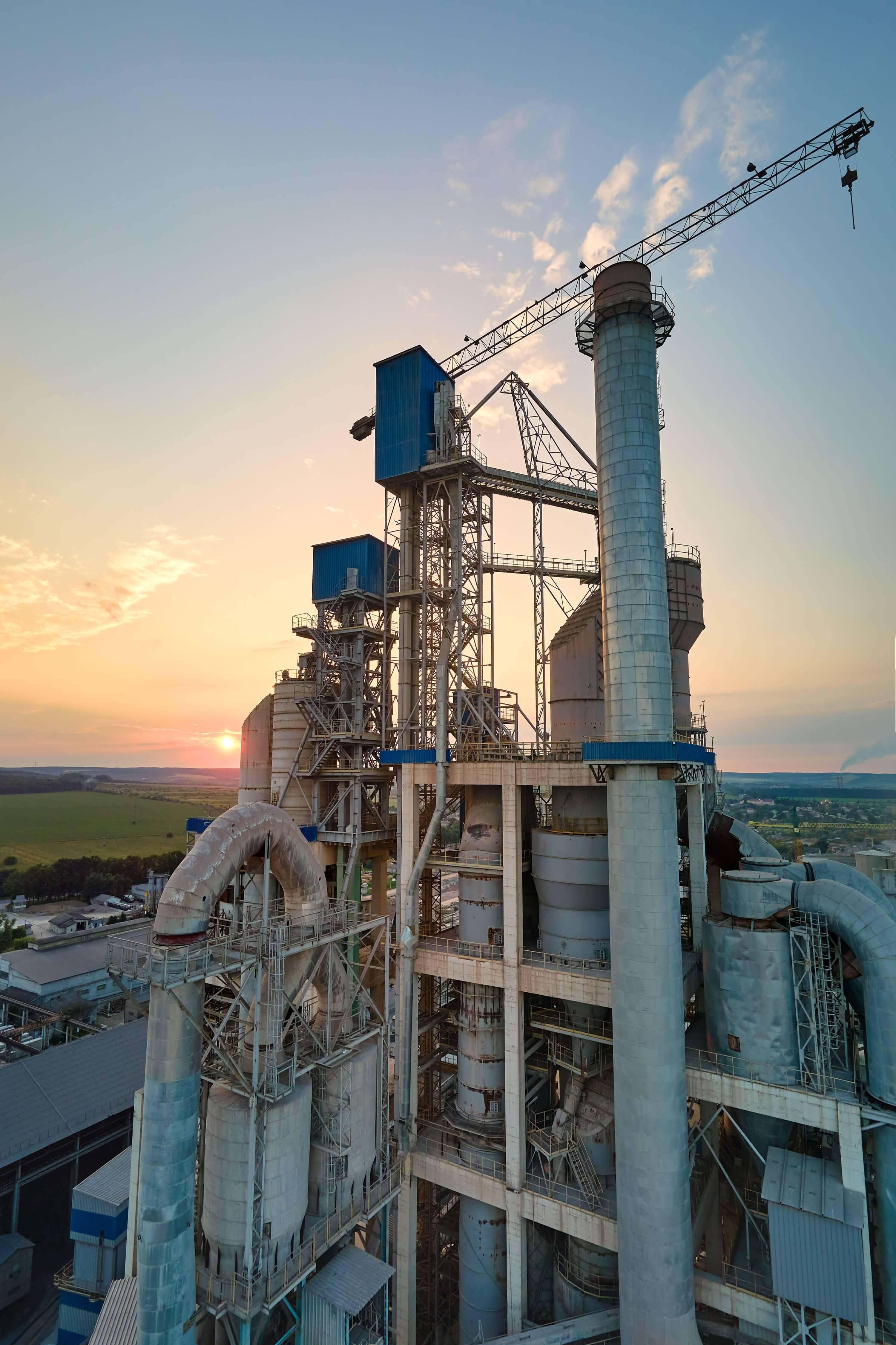 A4_cement-plant-with-high-factory-structure-tower-cranes-industrial-production-area-manufacture-global-industry-concept